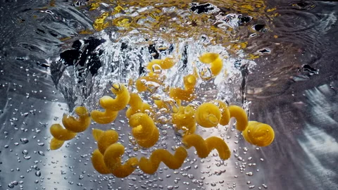 Pasta Falling Down in to the pot Slow motion 스톡 동영상 130911523
