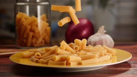 Pasta falling on a plate in slow motion Stock Footage 156787471