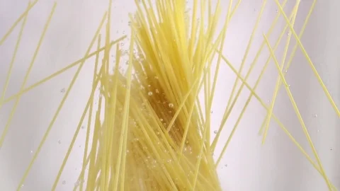 Pasta falling into water, slow motion Stock Footage 80387719