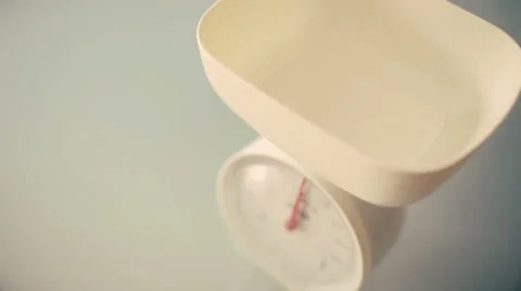 Pasta falling in weight scale Stock Footage 43363774