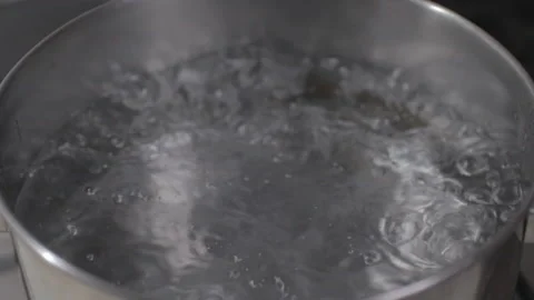 Pasta falls into the boiling water. Video stock 130381735
