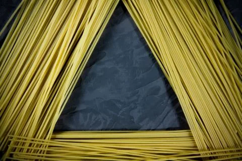 Pasta folded in the form of a triangle on a dark background Foto stock