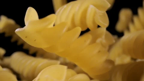Pasta Fusilli Falling Down black background, slow motion Stock Footage 112441938
