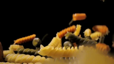 Pasta Fusilli Falling Down black background, slow motion Stock Footage 112446584