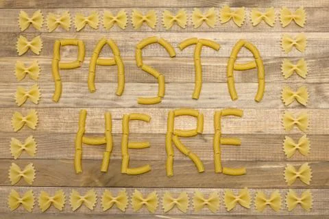 Pasta  here text made of raw pasta Stock Photos