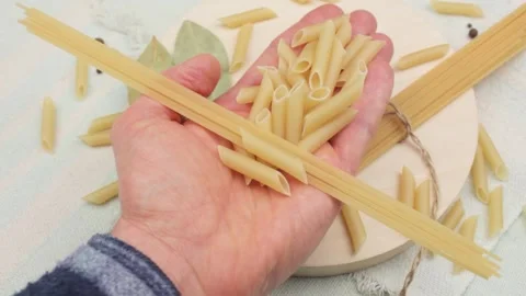 Pasta in his hand. Assortment selection of macaroni and pasta. Stock Footage 194672465