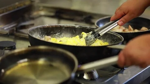 Pasta in hot pan, stiring Stock Footage 74998405