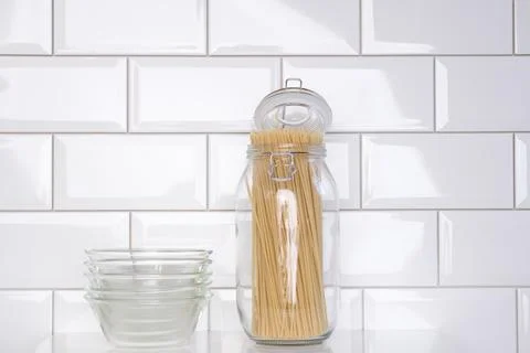 Pasta in a jar, empty plates Stock Photos