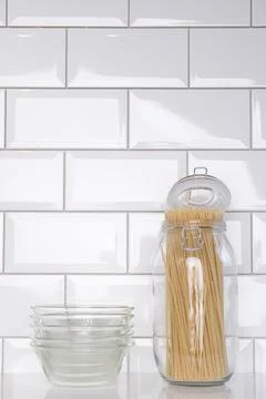 Pasta in a jar, empty plates Stock Photos