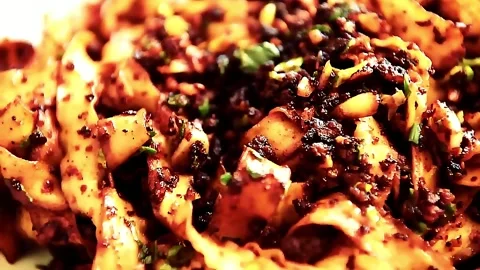 Pasta Made from Flat Wheat Tossed with Garlic, Chili Flakes, Herbs and Oil Stock Footage 327122873