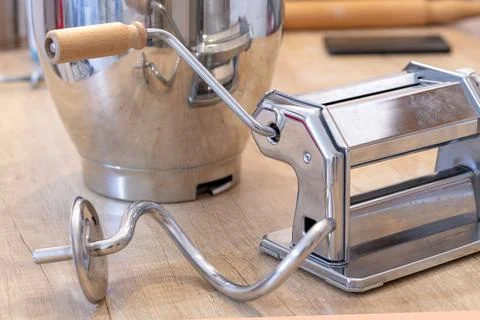 Pasta maker. Dough hook. Rolling out for dough, pasta. Machine for rolling .. Stock Photos