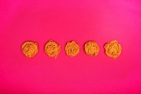 Pasta nests in row 写真素材