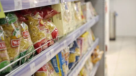 Pasta in the package on the counter of the store, different varieties of pasta Stock Footage 75219010