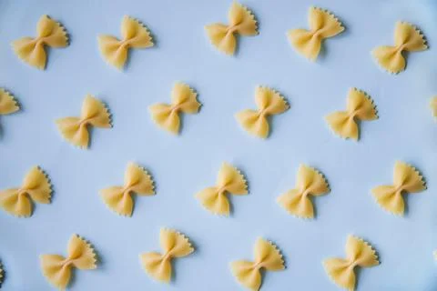 Pasta in a pattern on a colorful paper Stock Photos