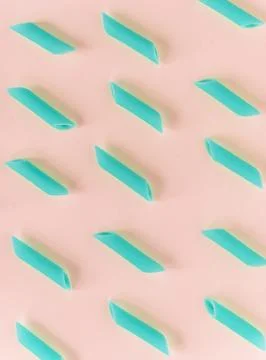Pasta in a pattern on a colorful paper Stock Photos