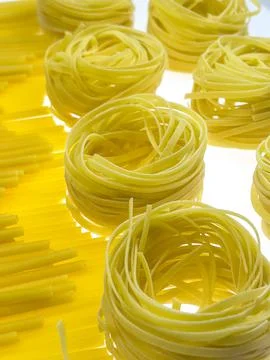Pasta pattern on a white background close-up. Stock Photos