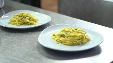 Pasta with peas ready to be served in a restaurant. Stock Footage 70258899