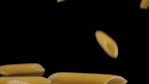 Pasta Penne Falling Down black background, slow motion Stock Footage 112454741