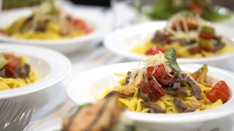 Pasta in the plate. table setting in a restaurant. Video stock 107077699