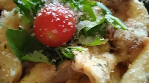 Pasta plate top view, macaroni with cherry tomato, salad and parmesan cheese. Stock Footage 197684537