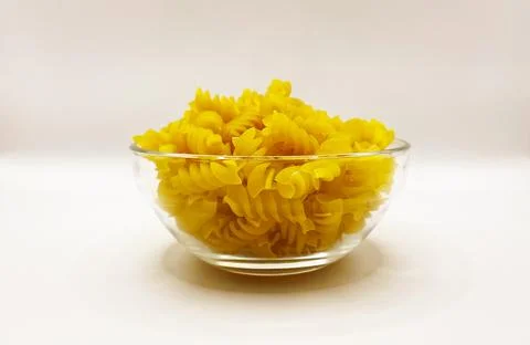 Pasta in a plate on a white background. A portion of pasta Stock Photos