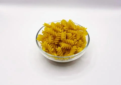 Pasta in a plate on a white background. A portion of pasta Stock Photos