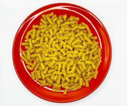 Pasta in a plate on a white background. A portion of pasta Stock Photos