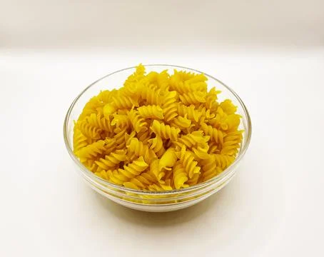 Pasta in a plate on a white background. A portion of pasta Stock Photos
