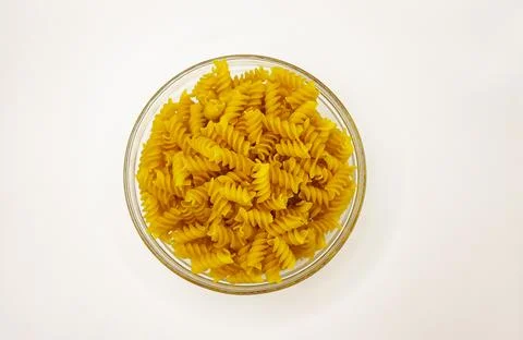 Pasta in a plate on a white background. A portion of pasta Stock Photos