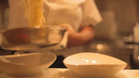 Pasta Plating in Restaurant Kitchen Stockbeeldmateriaal 41920432