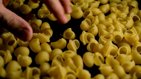 Pasta Pouring onto Plate Close Up Stock Footage 329966227