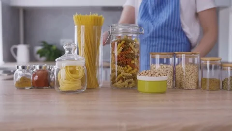 Pasta preparation in the grey kitchen and young cook Video stock 131548389