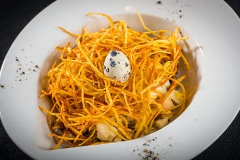 Pasta with quail egg Stock Photos