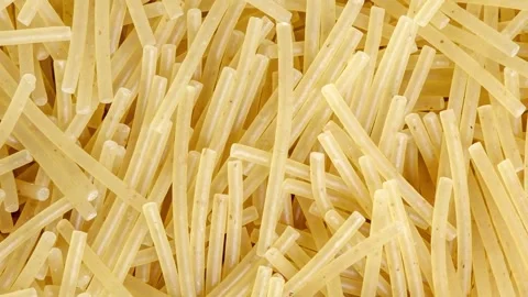 Pasta raw, vermicelli, rotating, turning, close-up Stock Footage 240645815