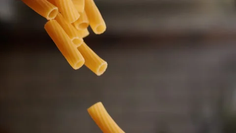 Pasta rigatoni falling in slow motion Stock Footage 156787609