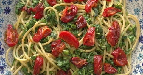 Pasta with Roasted Cherry Tomatoes and Arugula. Stock Footage 330134220
