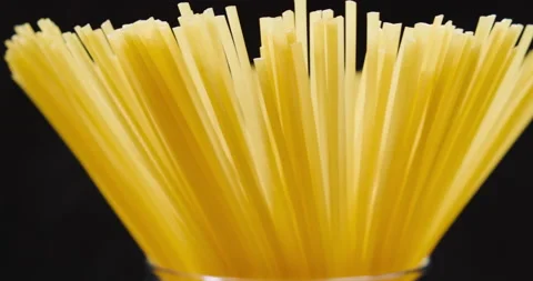 Pasta rotating on the table. On a black background. Video stock 154957883