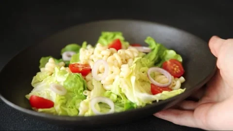 Pasta salad green leaf lettuce, tomato, pasta, onion fresh delicious gourmet Vidéo 313239541