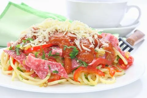 Pasta with salami Stock Photos