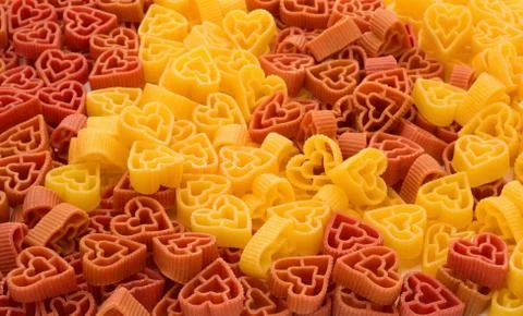 Pasta in shape of heart Stock Photos