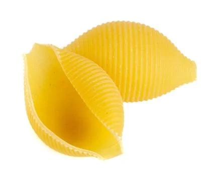 Pasta in the shape of a shell isolated on white background close up Stock Photos