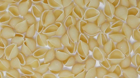 Pasta shells from above, rotating Stock Footage 117630722