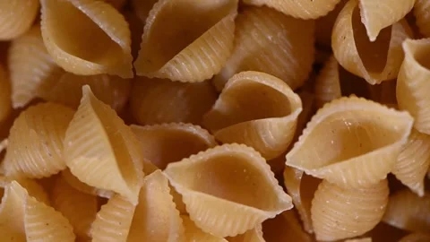 Pasta Shells Rotating in Vortex. Top-Down Seamless Loop of Conchiglie Stock Footage 325424686