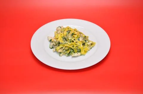 Pasta in spinach sauce Stock Photos