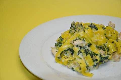 Pasta in spinach sauce Stock Photos