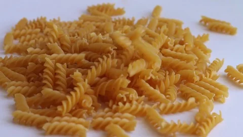 Pasta spiral falls white background Video stock 74248704