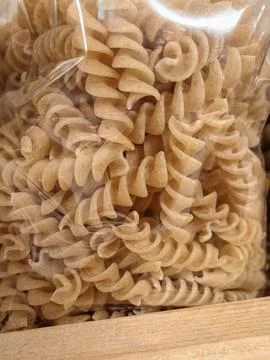 Pasta spirals in clear bag Stock Photos