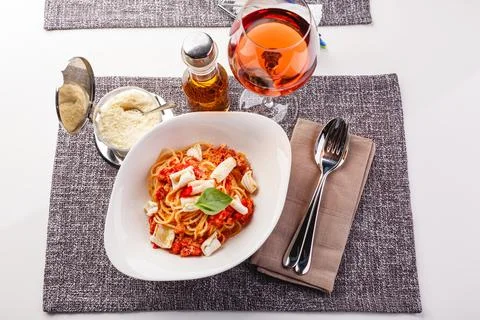 Pasta with squid and tomatoes Stock Photos