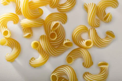 Pasta texture background. Pasta is a staple food of traditional Italian cuisi Stock Photos