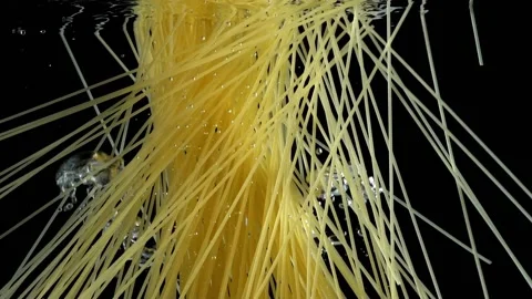Pasta throwing in the boiling water Stock Footage 130965748